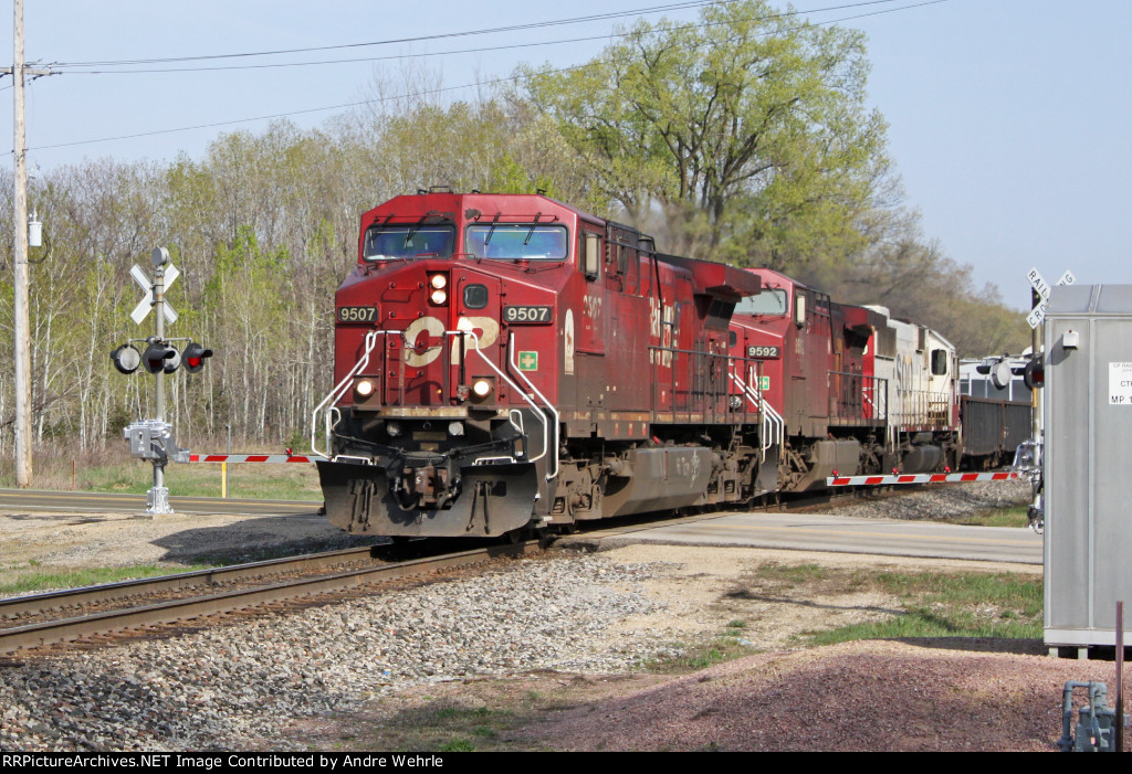 CP 9507 slams across County Highway P on the point of 281 westbound